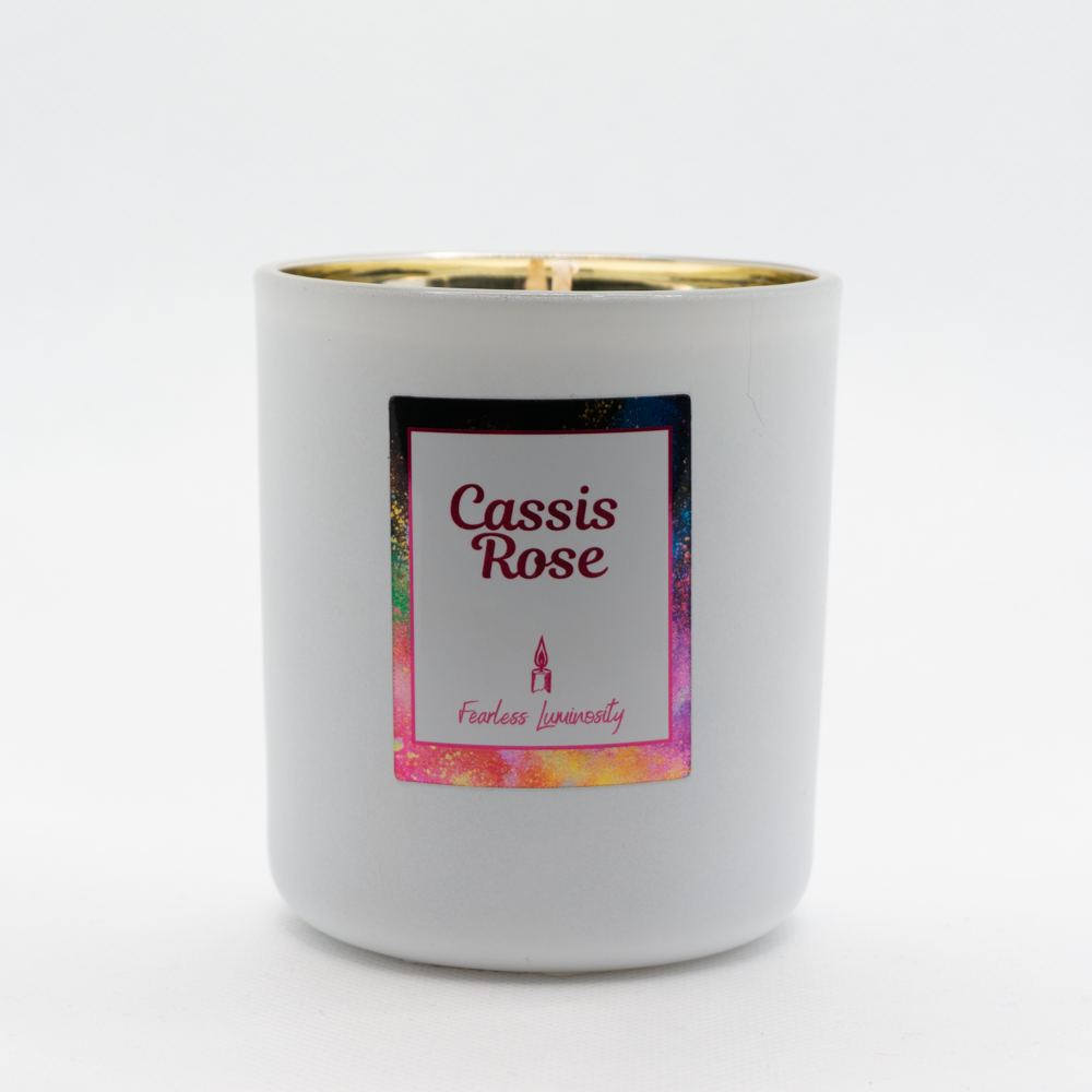 White candle, with gold inner, cotton wick and in Cassis Rose fragrance. 