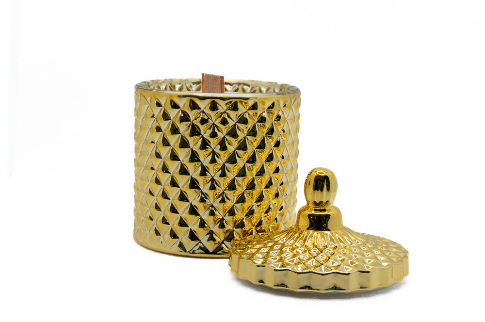 Wooden wick gold candle, with lid removed and next to it, perfect for festive period. 