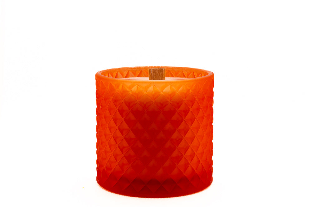 Wooden wick showing with the lid removed from the candle, matt orange colour, bold and beautiful. 