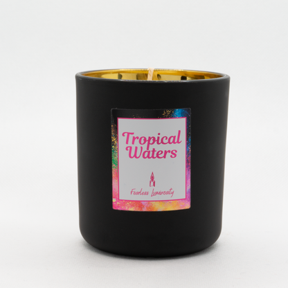 Black outer Candle with gold reflective inner candle and Tropical Water fragrance. Cotton Wick. 
