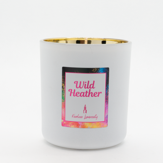 White candle, with gold inner, cotton wick and in Wild Heather fragrance. 