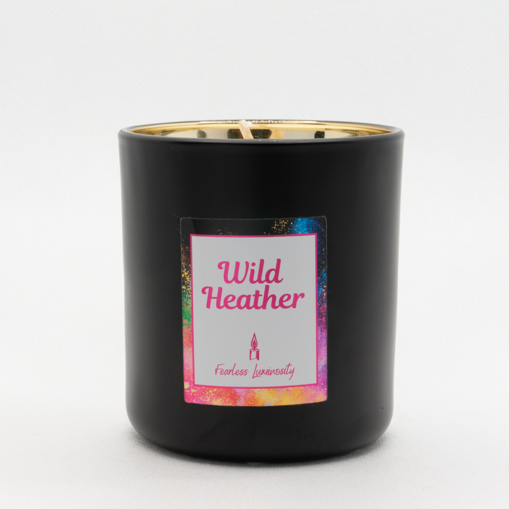 Black outer Candle with gold reflective inner candle and Wild Heather. Cotton Wick. 